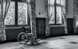A wheelchair sitting in an empty room